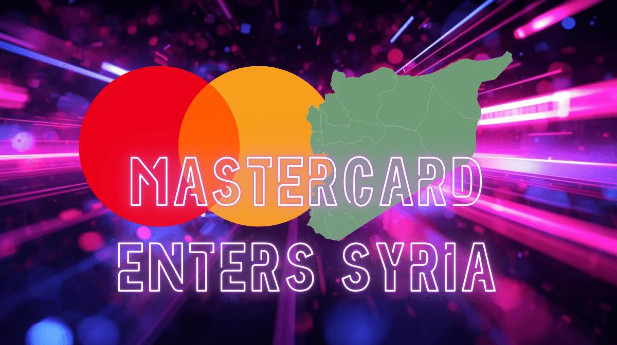 A graphic announcing ‘Mastercard Enters Syria,’ featuring the Mastercard logo over a neon, futuristic background. A green silhouette map of Syria appears beside the logo, emphasizing the geographic context of the announcement.